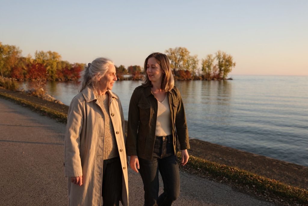 Two Zonta members walking along a Great Lakes shoreline